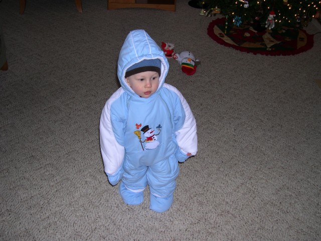 Attempting to stand in the snowsuit