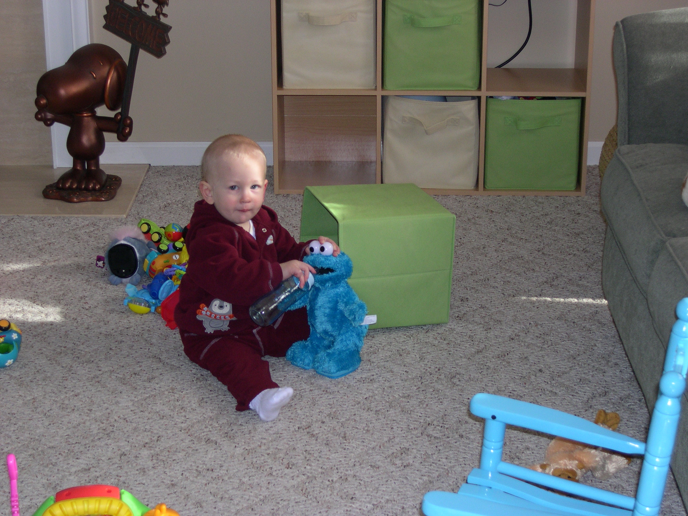 Nicky giving Cookie Monster a bottle