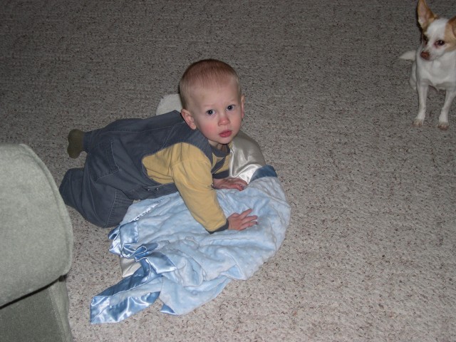 Playing with his blankets