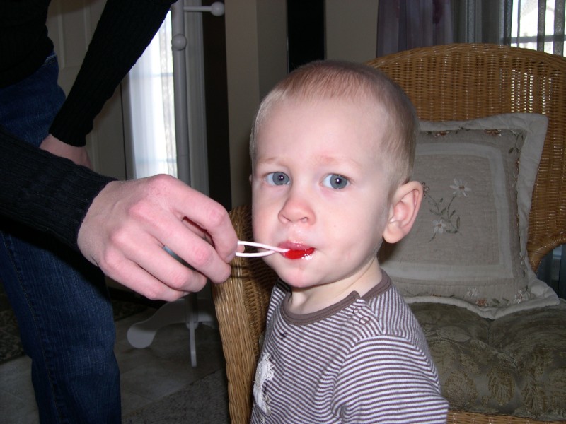 Nicky sharing a sucker with Mommy