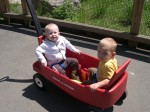 Nicky and Parker ride in the wagon at the zoo