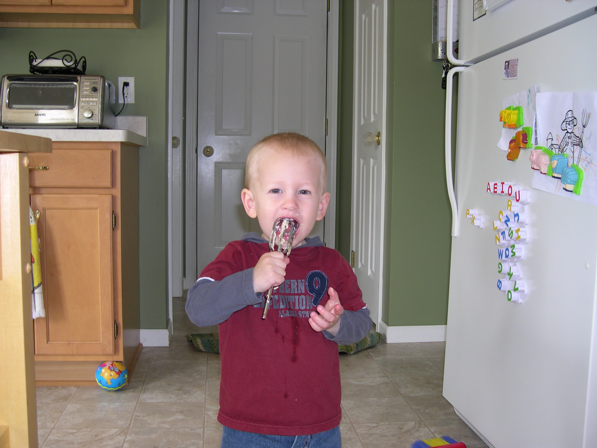 Nicky licking the batter, yum!