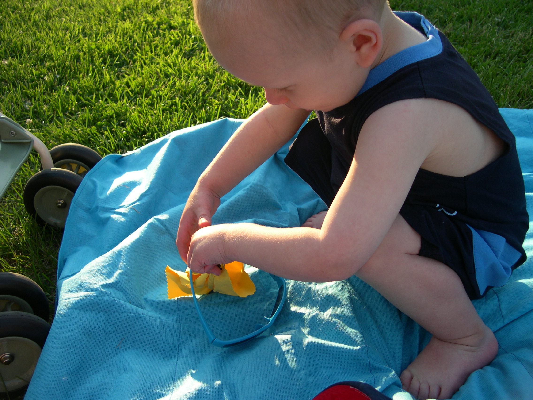 Nicky wiping his sunglasses