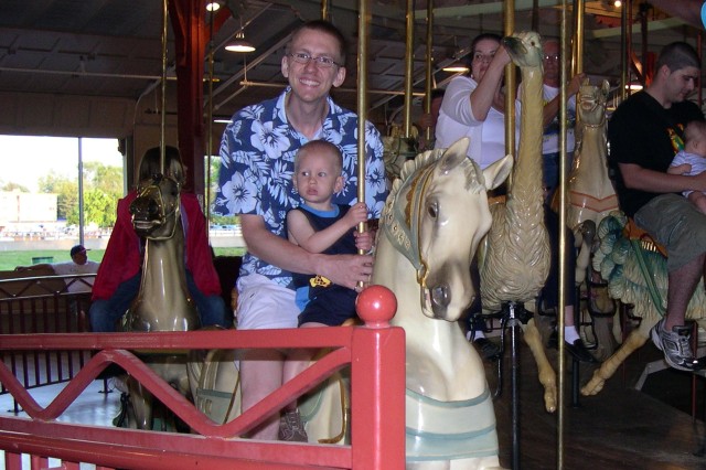 Nicky and Daddy on the carousel