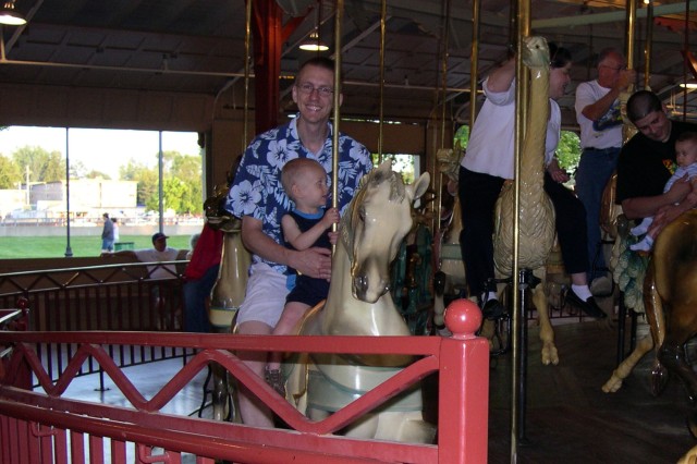 Nicky and Daddy on the carousel