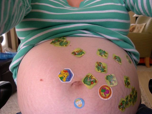 Nicky REALLY likes to put stickers on the belly!