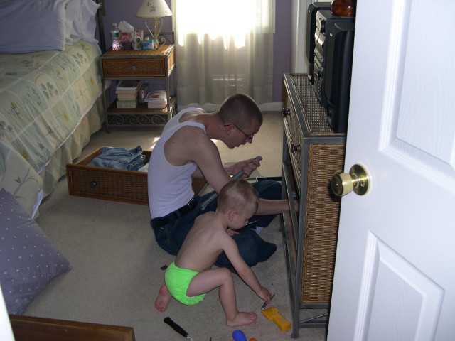 Nicky and Daddy fixing the dresser drawer