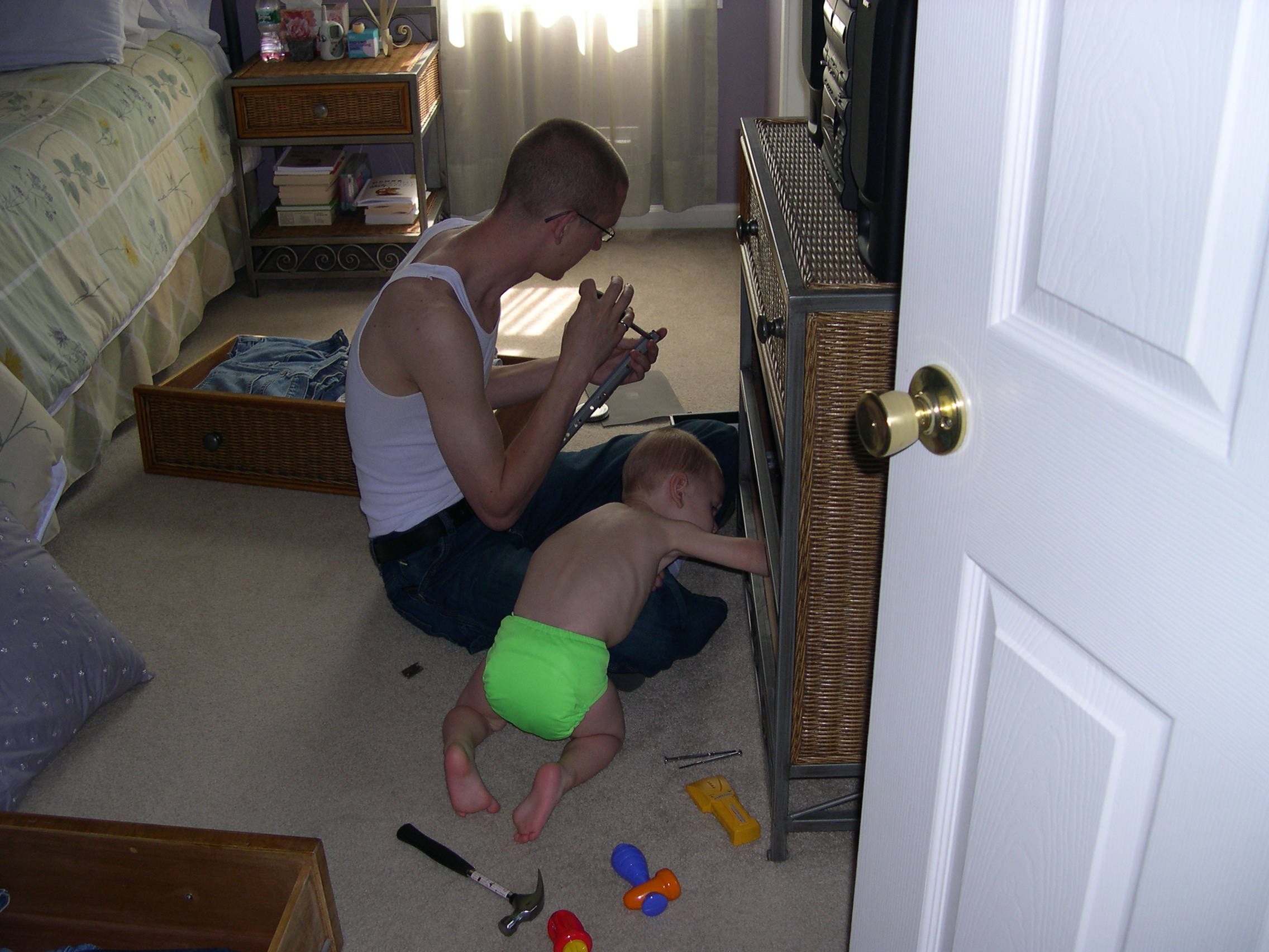 Nicky and Daddy fixing the dresser drawer