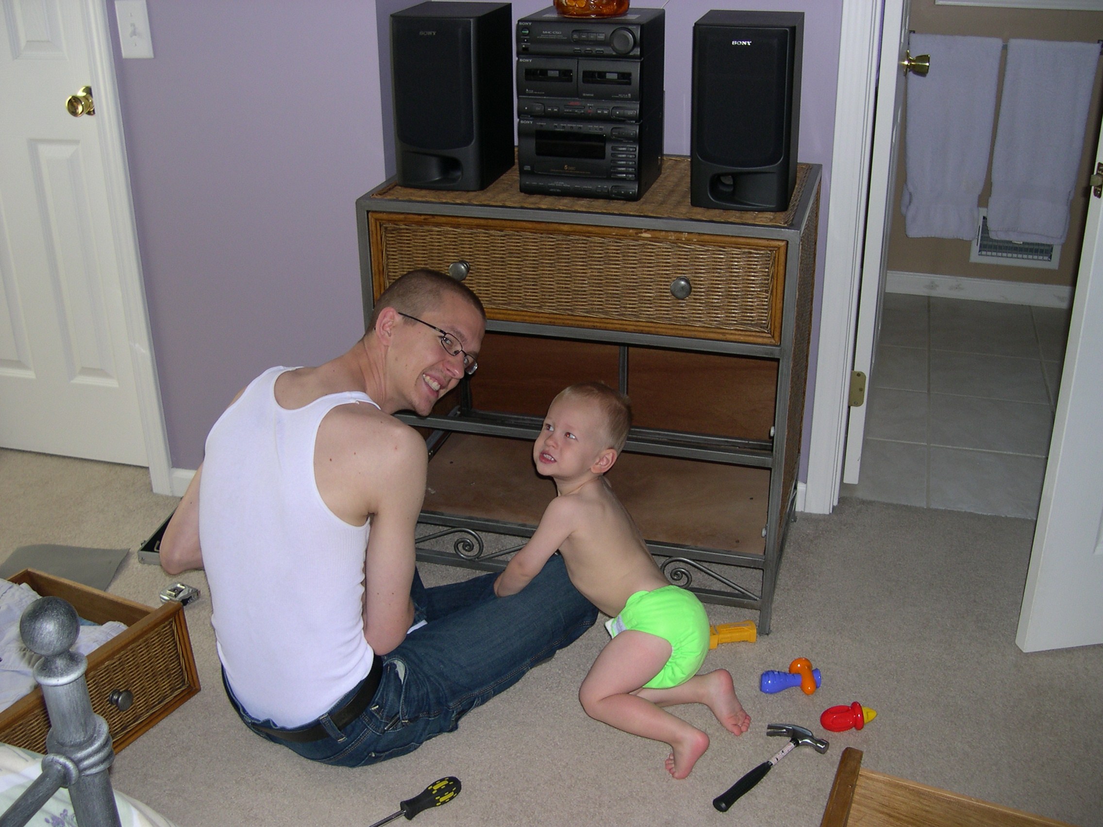 Nicky and Daddy fixing the dresser drawer