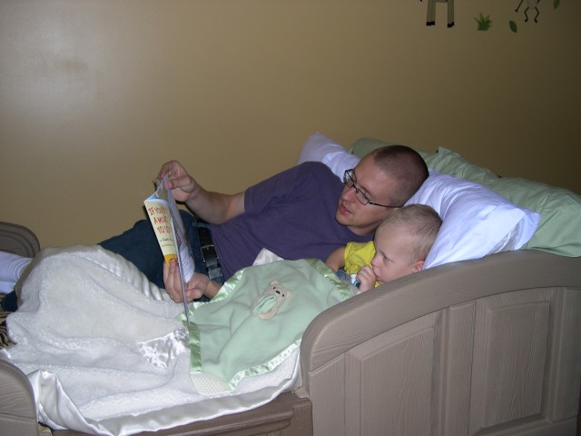 Daddy reading to Nicky before naptime