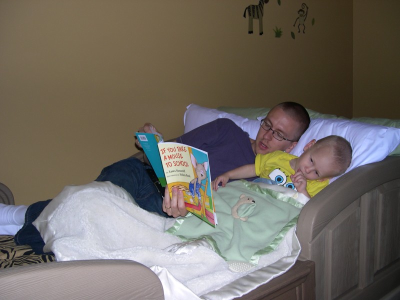 Daddy reading to Nicky before naptime