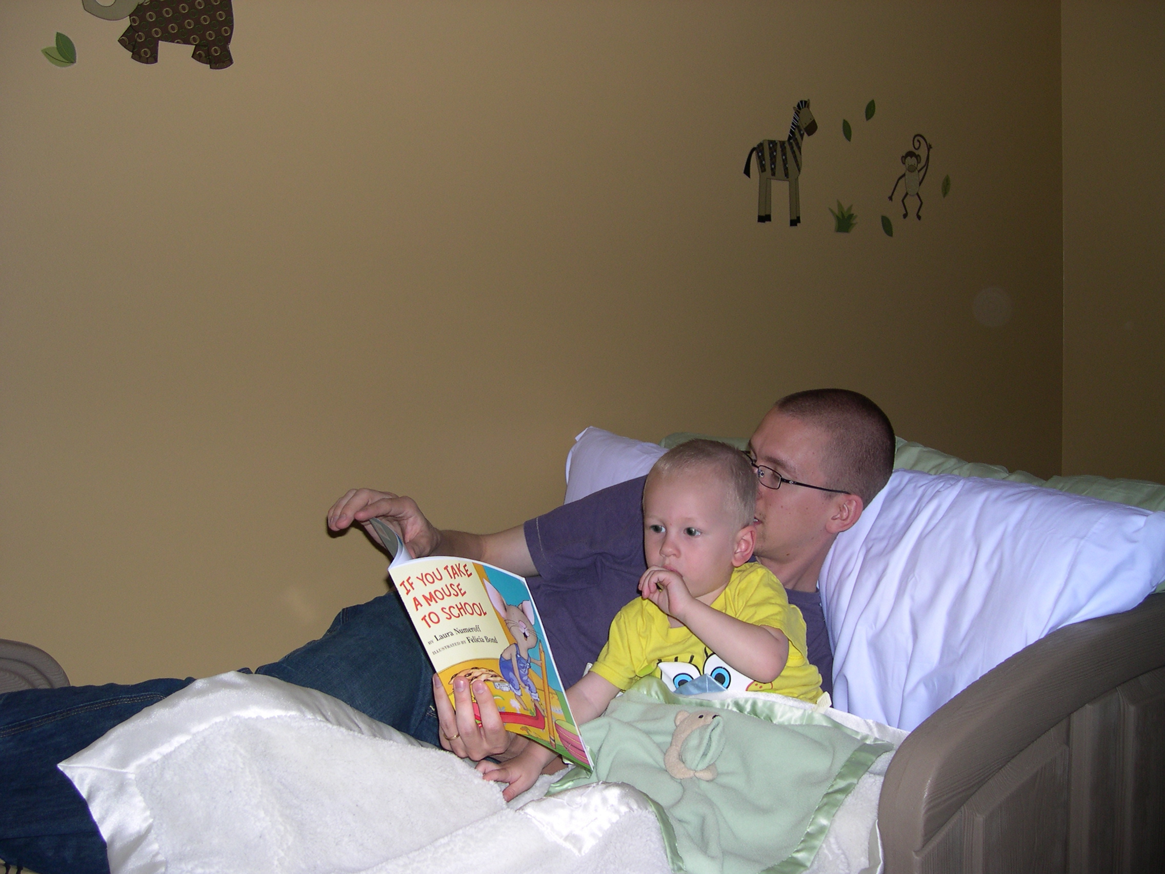 Daddy reading to Nicky before naptime