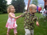 Nicky leading Rylie around her birthday party