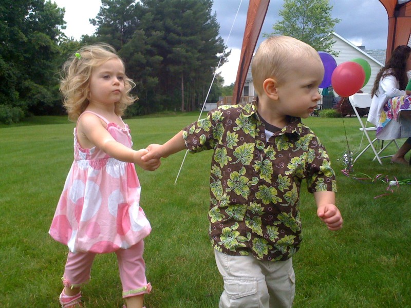 Nicky leading Rylie around her birthday party