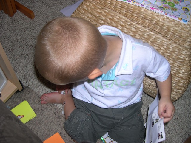 Nicky putting stickers on his feet