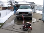 Dad washing truck with new pressure washer