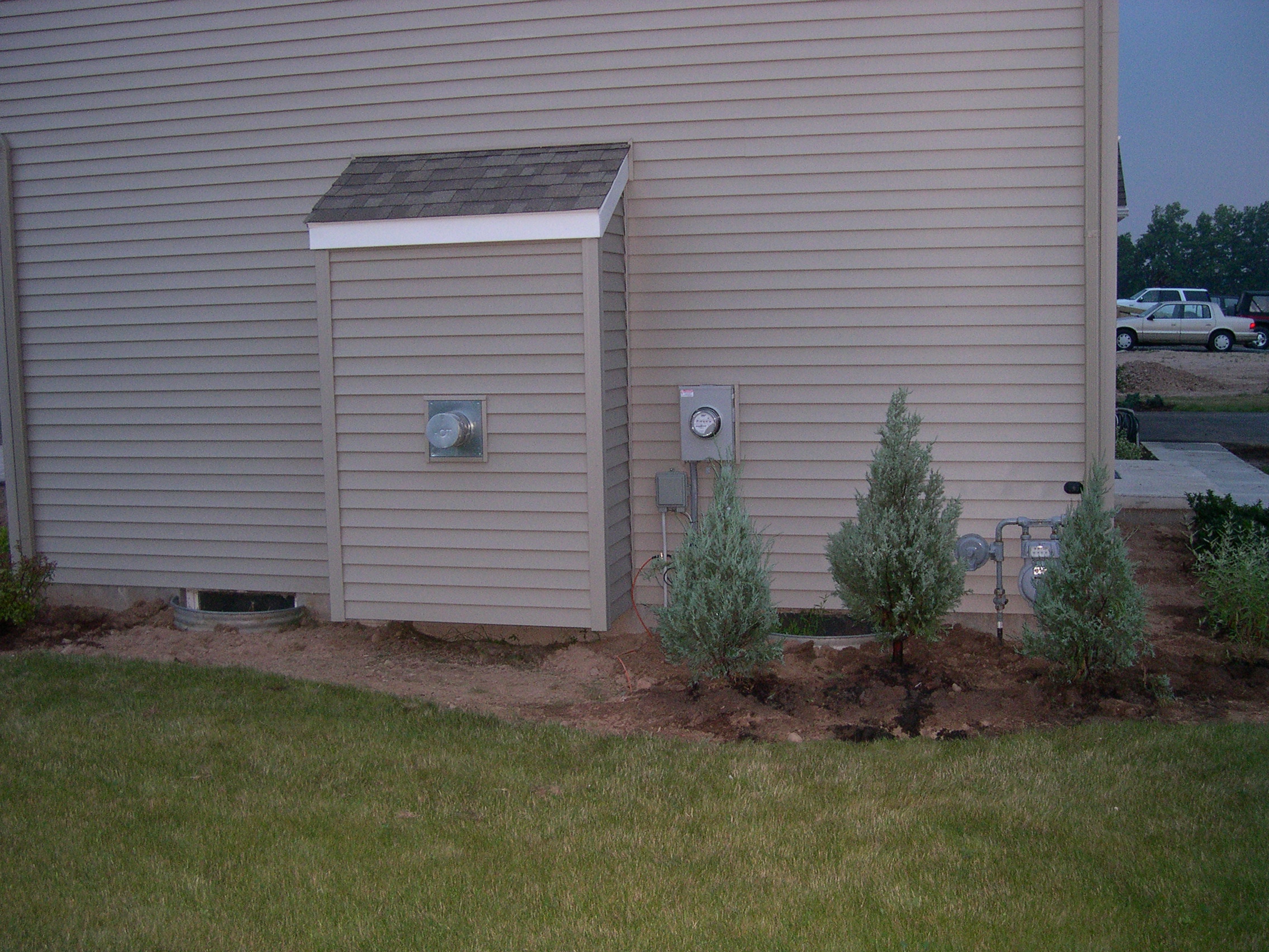 Side of house by the fireplace