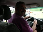 Ken happily driving home