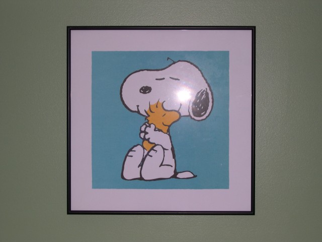 Snoopy hugging Woodstock over the changing table