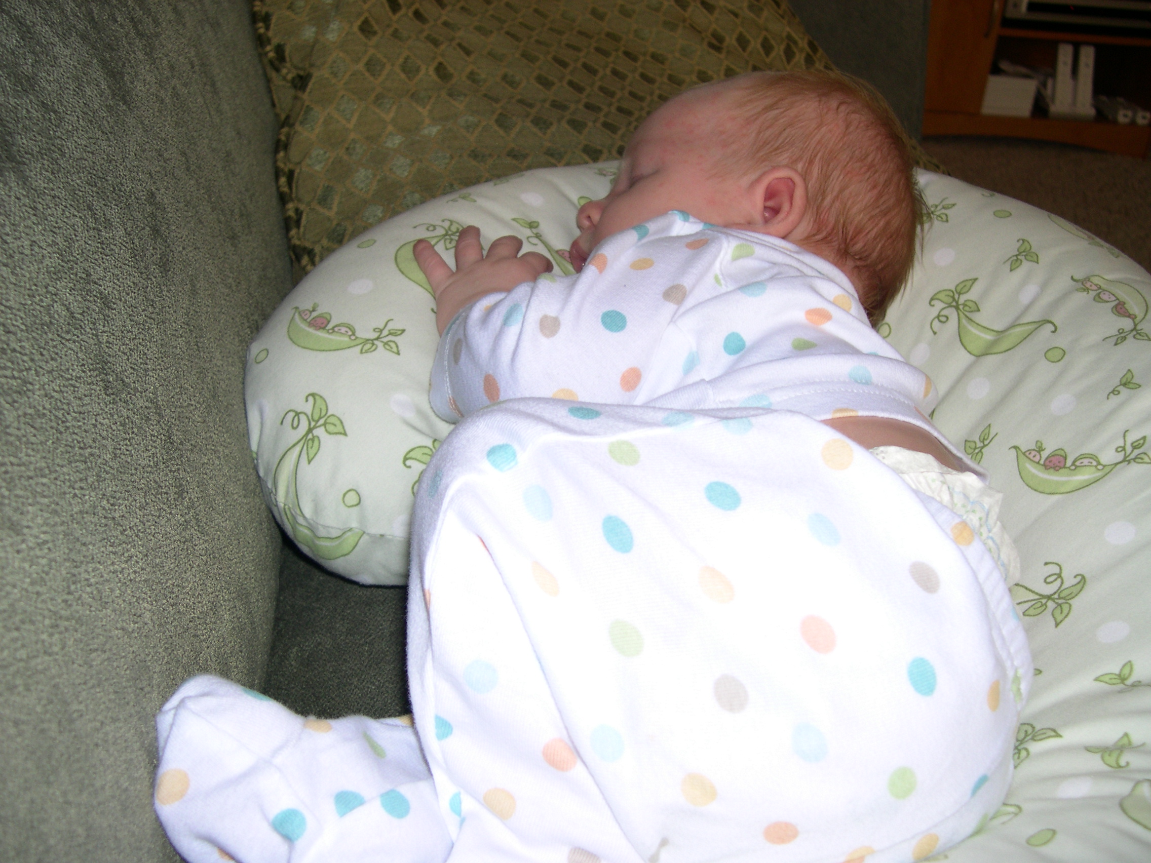 Nicky sleeping in the Boppy