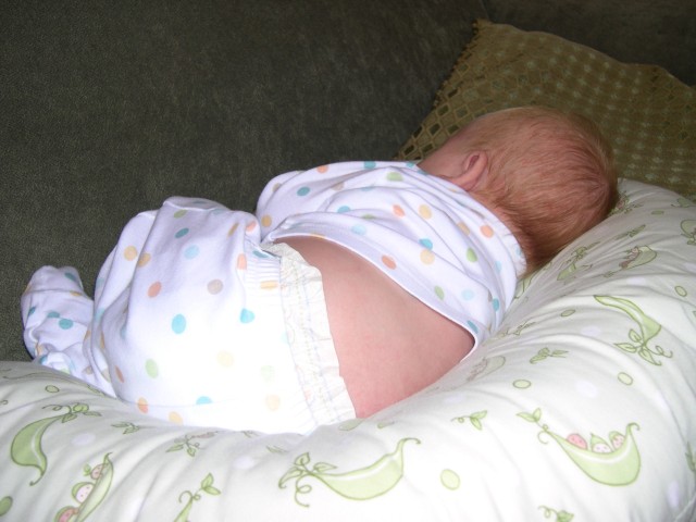 Nicky sleeping in the Boppy